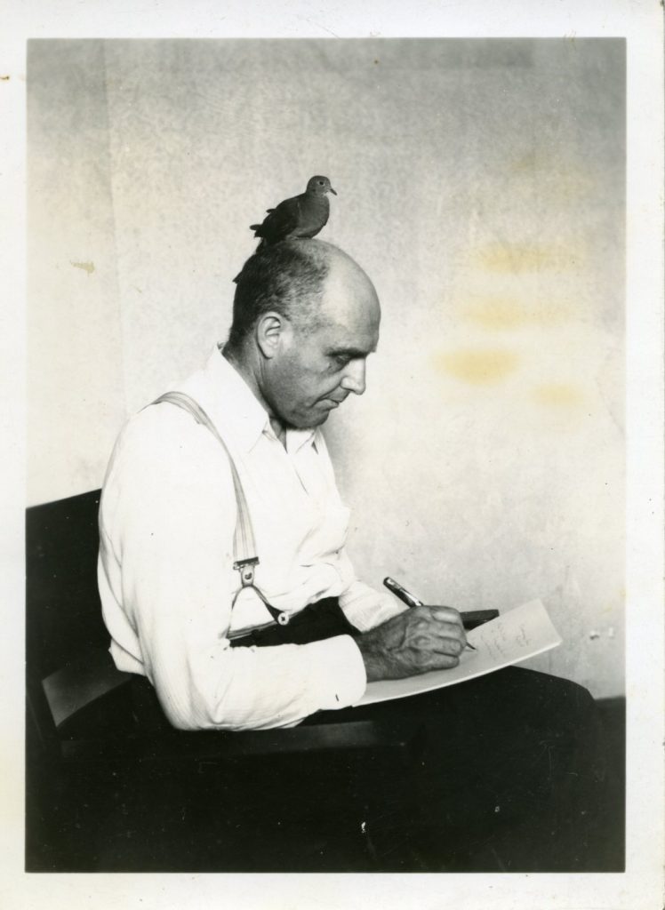 Robert Sparks Walker with his pet bird, Noah.