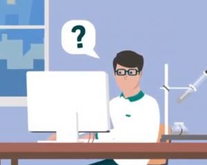 person with question bubble thinking at desk