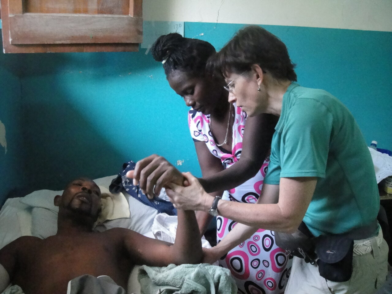 Dr. June Hanks, right, works with a patient