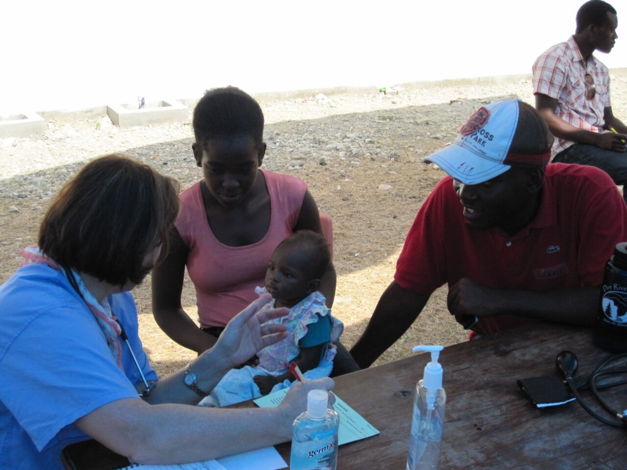 Dr. Chris Smith takes information on a tiny patient