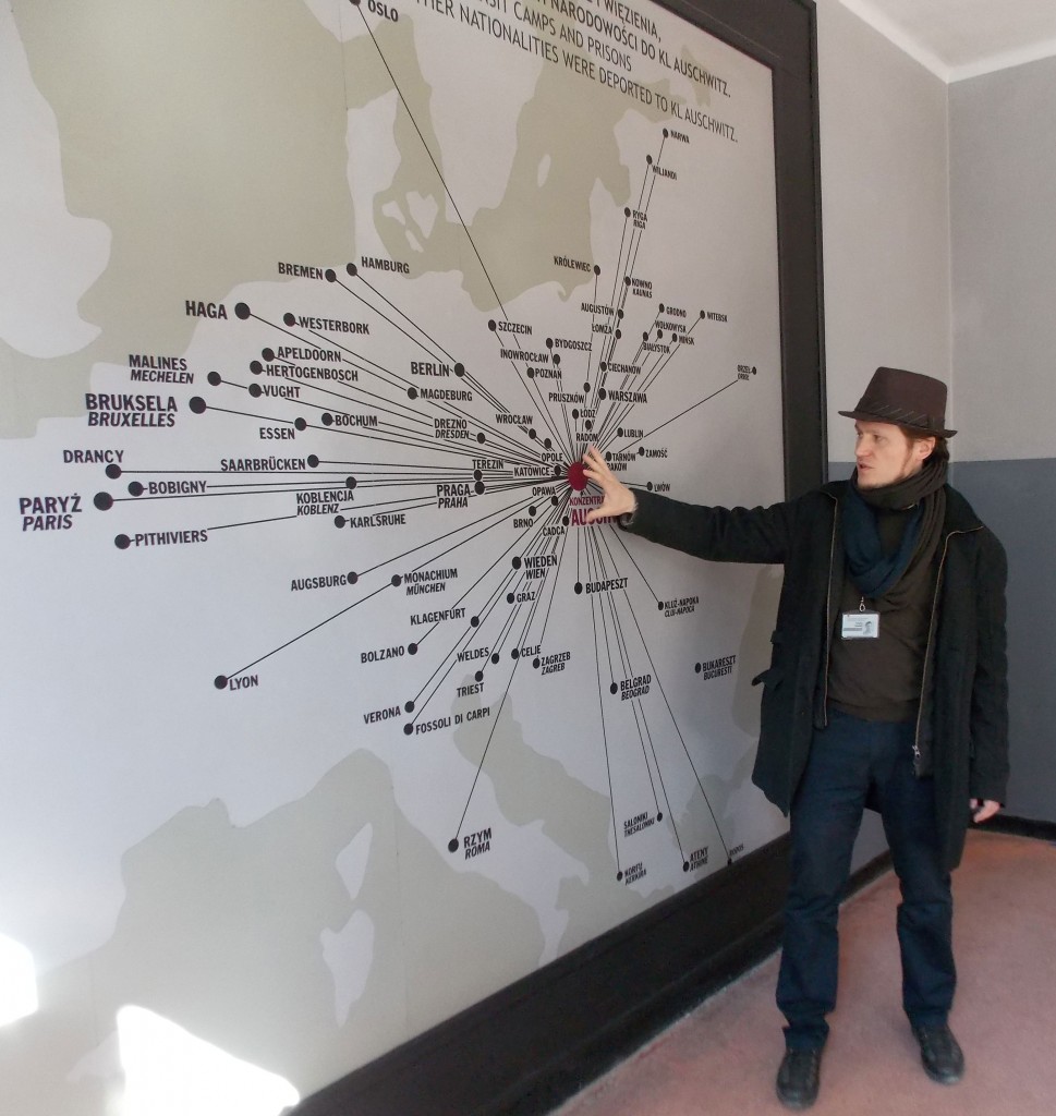 The tour guide for the UTC group, Tomasz, shows a diagram of the towns where prisoners lived before they came to Auschwitz.