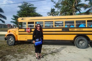 Leah Keith-Houle in front of School Bus
