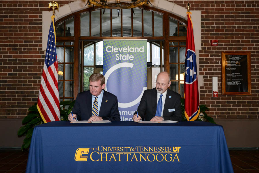 UTC Chancellor Steven Angle and Cleveland State Community College President Bill Seymour sign documents