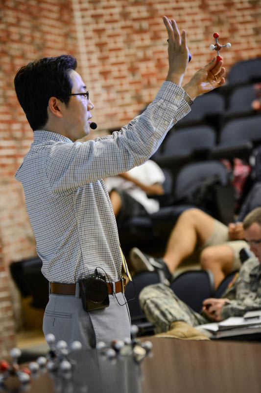 Teacher Lecturing Students in Classroom
