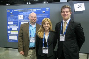 Lee, Latendresse, and Riner stand in front of Chemistry research