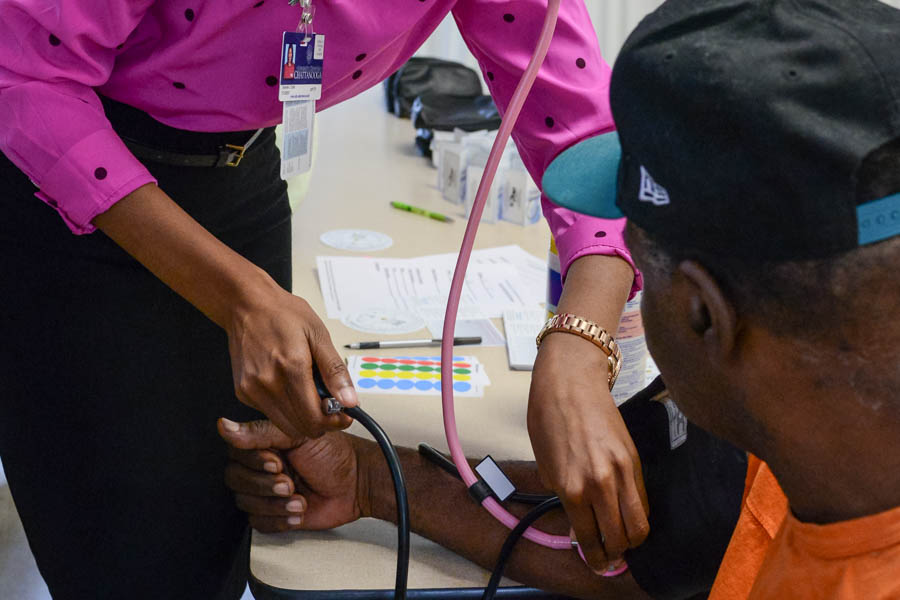 Nursing student checking blood pressure