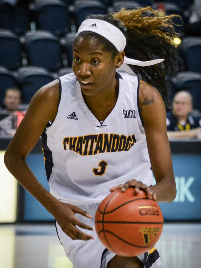 UTC Women's Basketball player dribbling