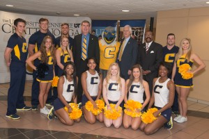 Chancellor Angle, Comissioner Bill Gibbons, Scrappy Moc and UTC Cheerleaders pose for group picture