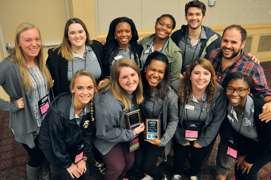 CAB team holding awards of excellence