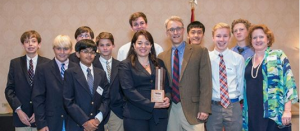 Veronica Herrera with students, winning La Paz’s Chattanooga Choice Leadership Award.