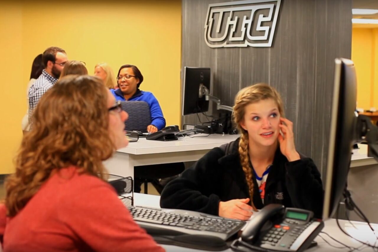 Students receiving enrollment help at the Mocs One Center