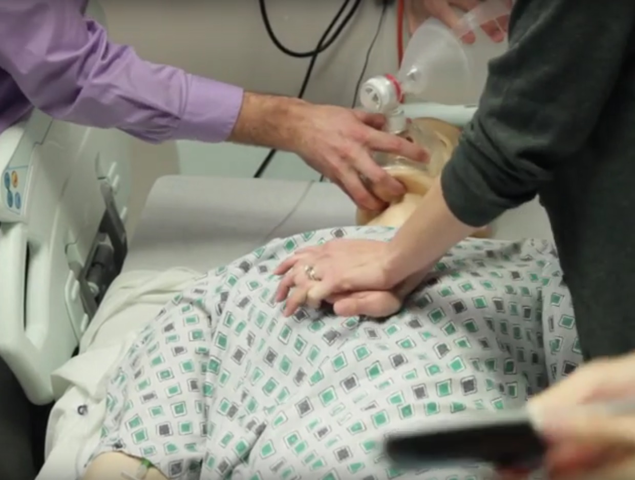A dummy receives CPR during a nursing simulation