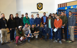 UTC engineering students photographed during a tour of the Amazon facility