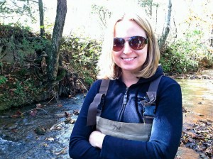Hope Klug in waders in a creek