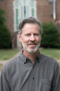 Dr. Greg O'Dea, posing for a headshot on an overcast day.