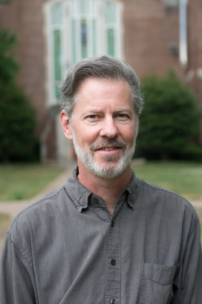Dr. Greg O'Dea, posing for a headshot on an overcast day.