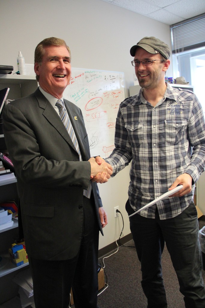 Chancellor Steven Angle with March recipient, Ethan Hereth