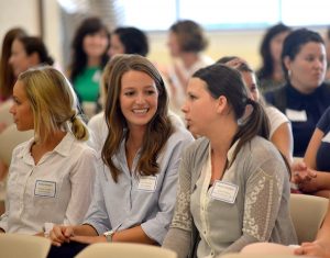 students listen to teachers speak