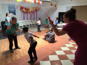 Students playing with Costa Rican children on their "play day".