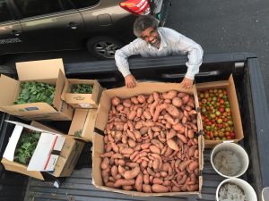 Dr. Jose Barbosa, loading up produce.
