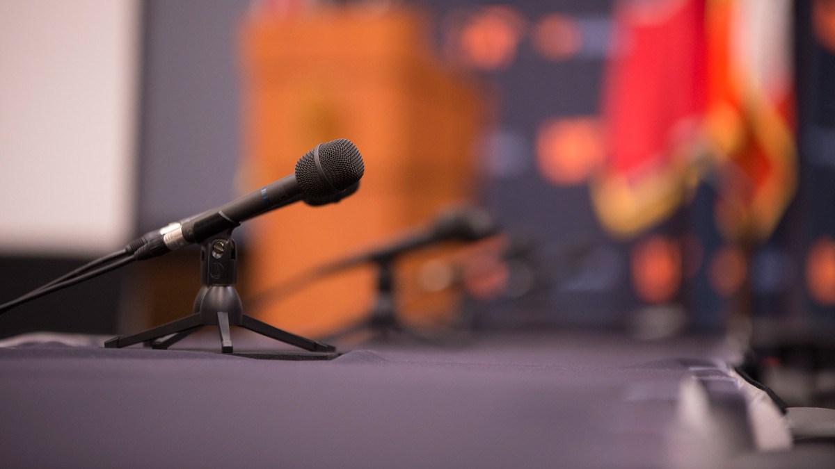 background image: microphones on a table