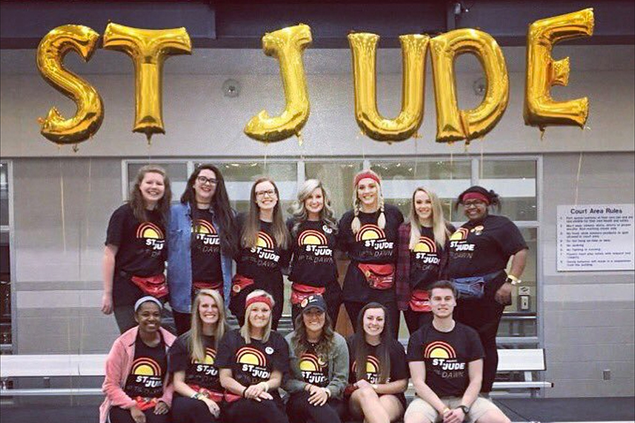 Group of students under St. Jude letter balloons