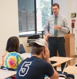 ACT test prep instructor Ryan Gallagher works through a problem with students July 2017