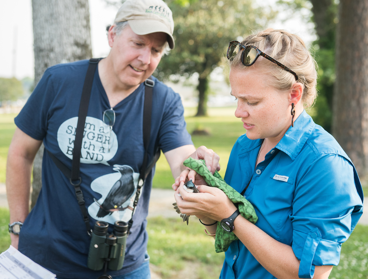 Pascale Lubbe (blue) and Sarah Whitney work Tuesday, May 15, 2018 with Dr. David Aborn on a collaborative project with the Cornell Lab of Ornithology studying tree swallows.The project involves monitoring swallow nests and taking blood samples from the birds.