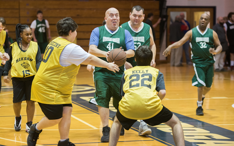 Players on the Hixson and Orange Grove teams participate in the Special Olympics basketball tournament.