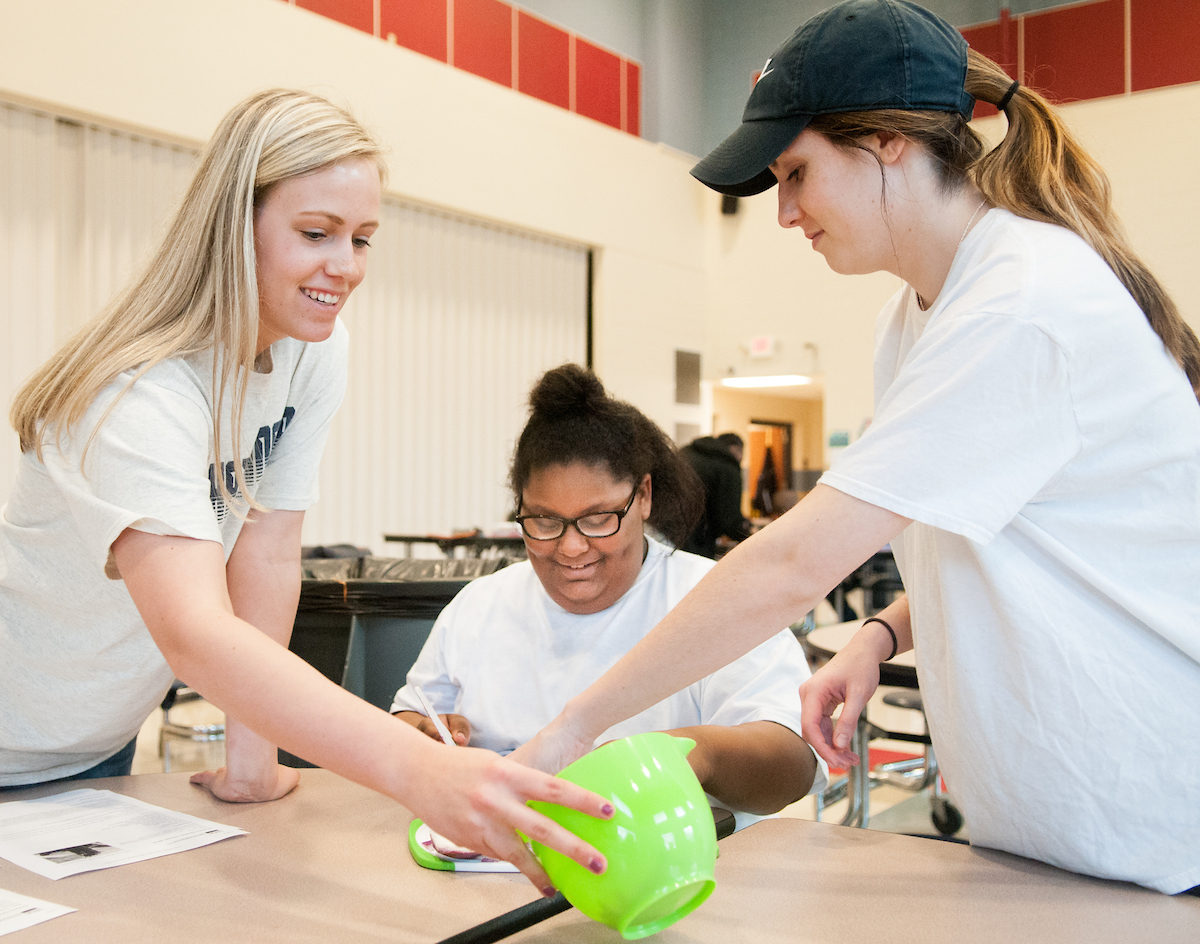 Quira Norwood receives helping hand from Alexandra Welch