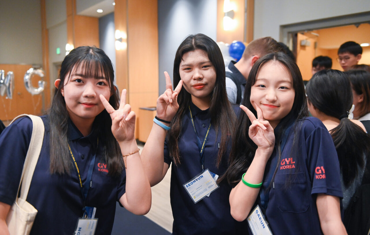 South Korean students shoot the peace sign during a luncheon held Wednesday, July 24, to welcome them to UTC.