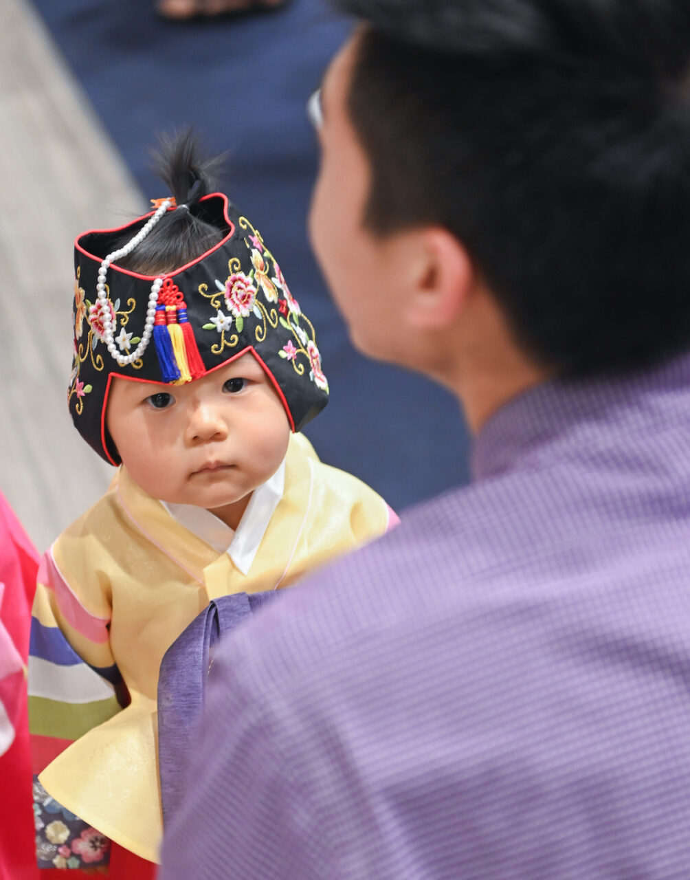 Han Park, assistant professor of chemistry, brought his daughters dressed in traditional Korean attire.