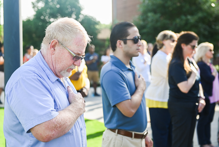 Faculty, students and staff show their respect for servicemen killed four years ago on July 16.