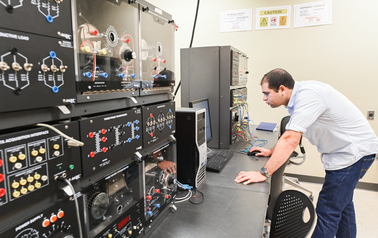 Khalid Tantawi, a professor in mechatronics, works with some of the components used in mechatronics.