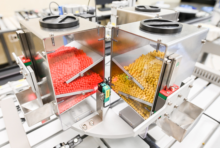 The production line in the mechatronics lab starts with colored plastic balls as the "product."