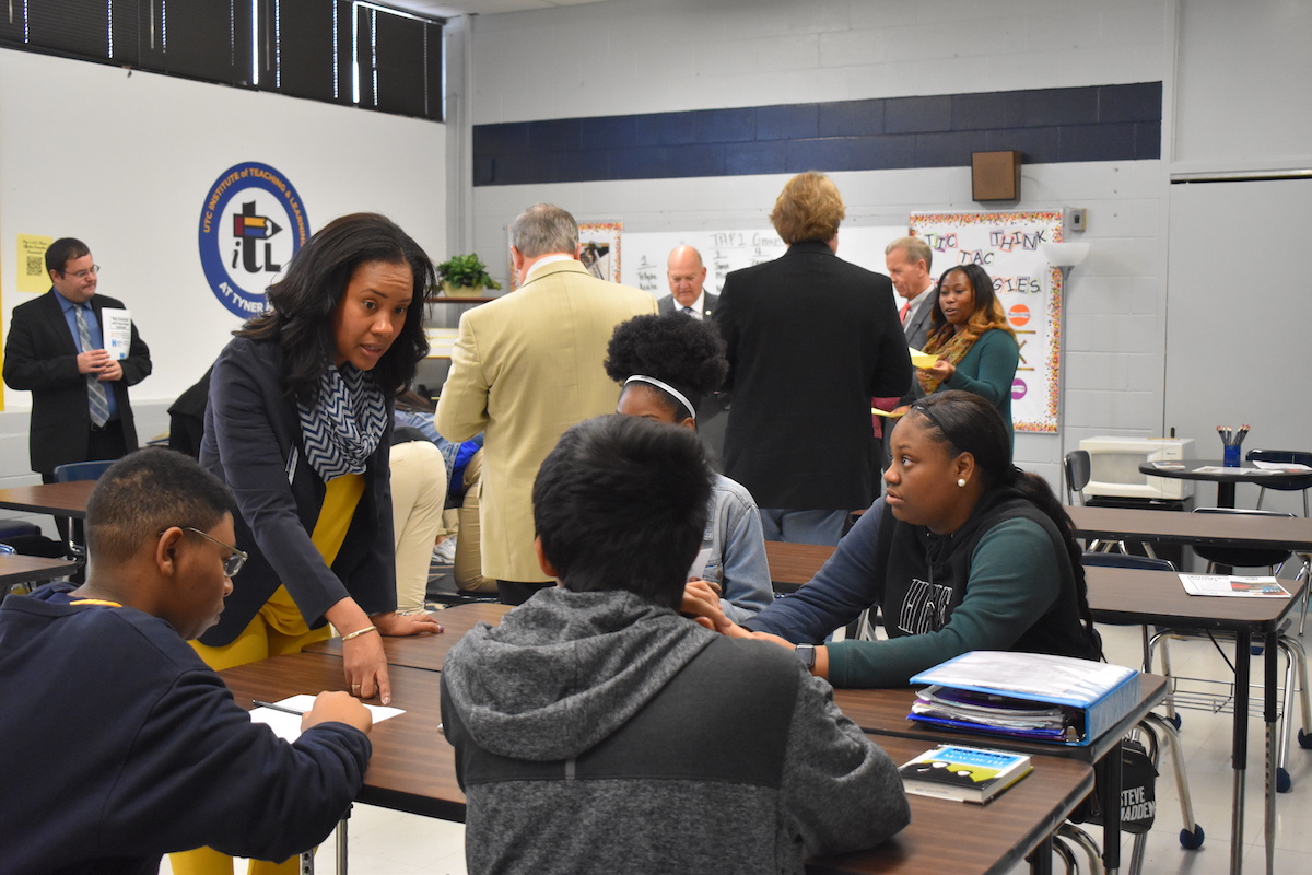 Jennifer Ellis from the UTC School of Education works with students in the UTC Teaching and Learning Institute at Tyner Academy.