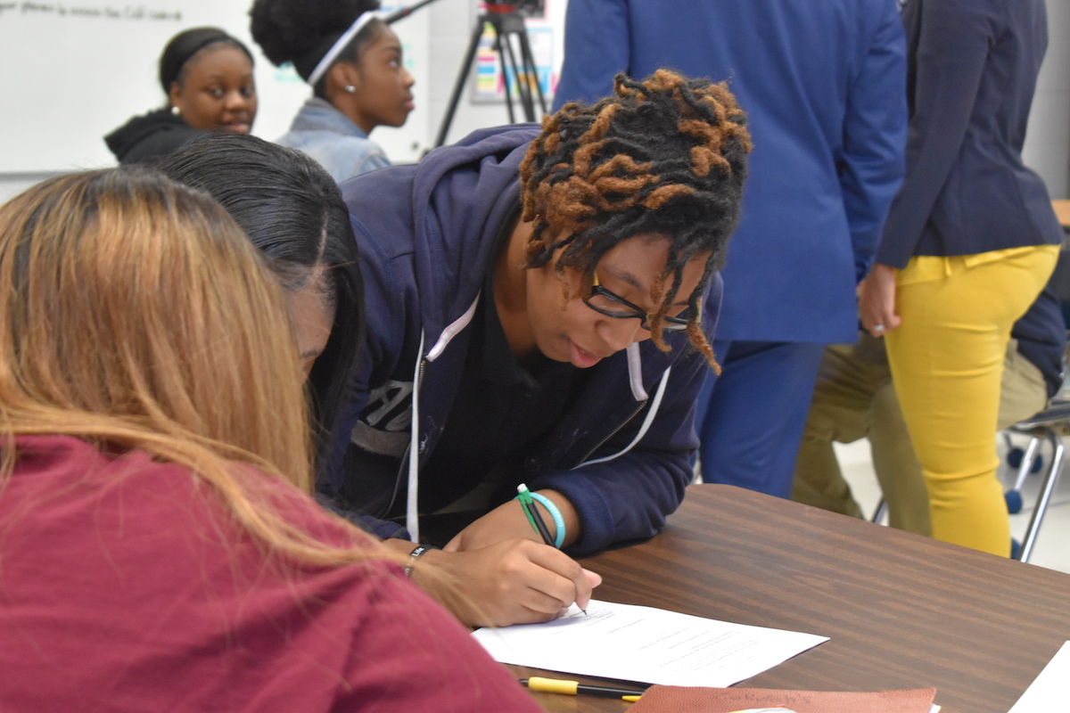 Students in the UTC Teaching and Learning Institute work on an assignment.