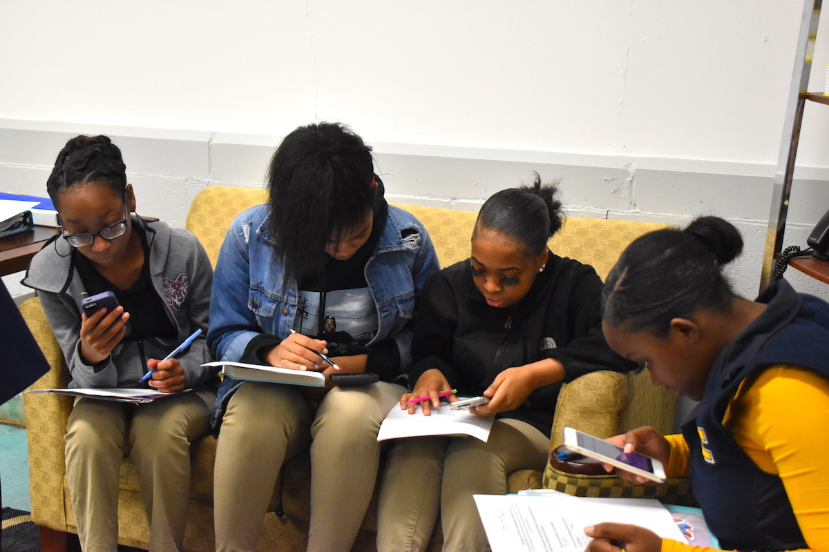 Students in the UTC Teaching and Learning Institute work on an assignment at Tyner Academy.