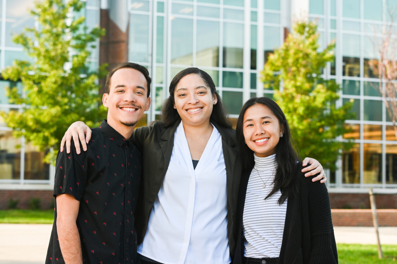 Endia Butler, center, (works in Financial Aid) with her two mentees, Juan Aponte, left, and Amanda Lin.