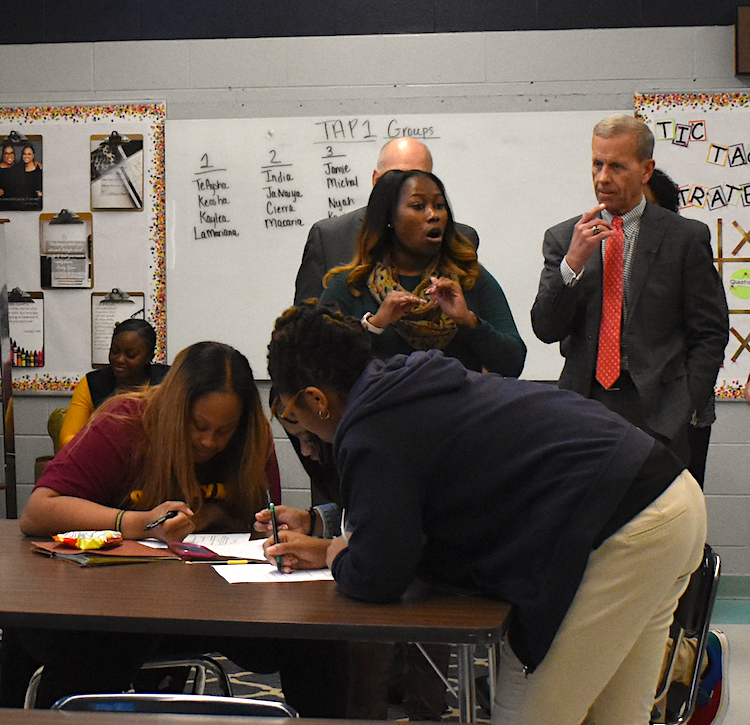 Frank Brogan, assistant secretary in the U.S. Office of Elementary and Secondary Education, watches as students in the UTC Teaching and Learning Institute work on a class assignment at Tyner Academy.