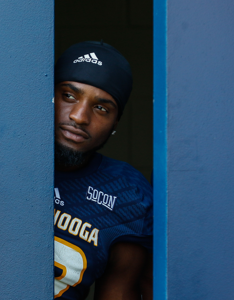 Elian Richter photo: Chattanooga Mocs wide receiver Reginald Henderson peeks out of the locker room before the UTC football game against Western Carolina University at Finley Stadium.