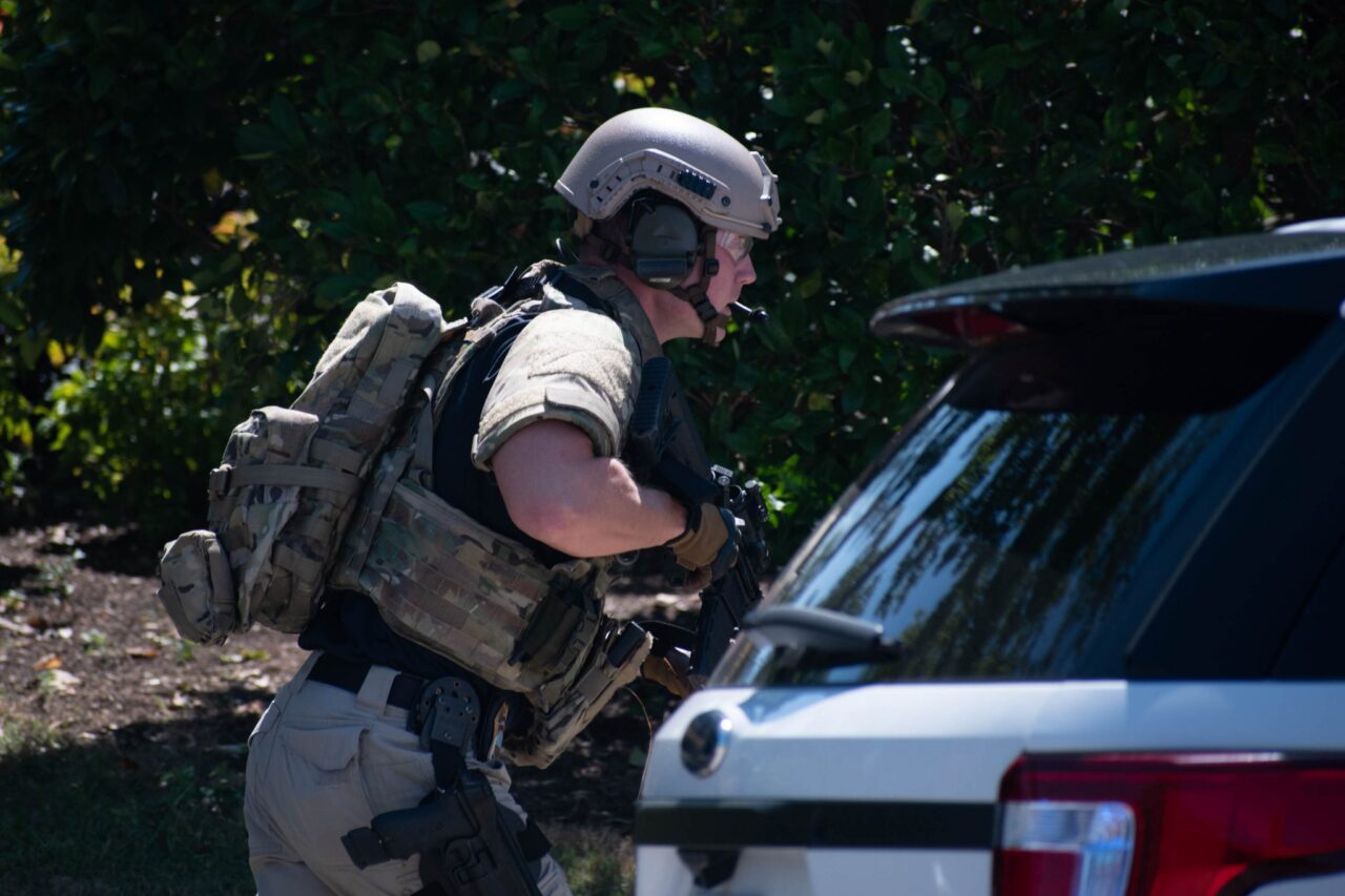 Elian Richter photo: A police officer in tactical gear runs to his position on the UTC campus outside Fletcher Hall on Aug. 28, 2019. A report of a possible shooter had been released by the Chattanooga Police Department. The report turned out to be false.
