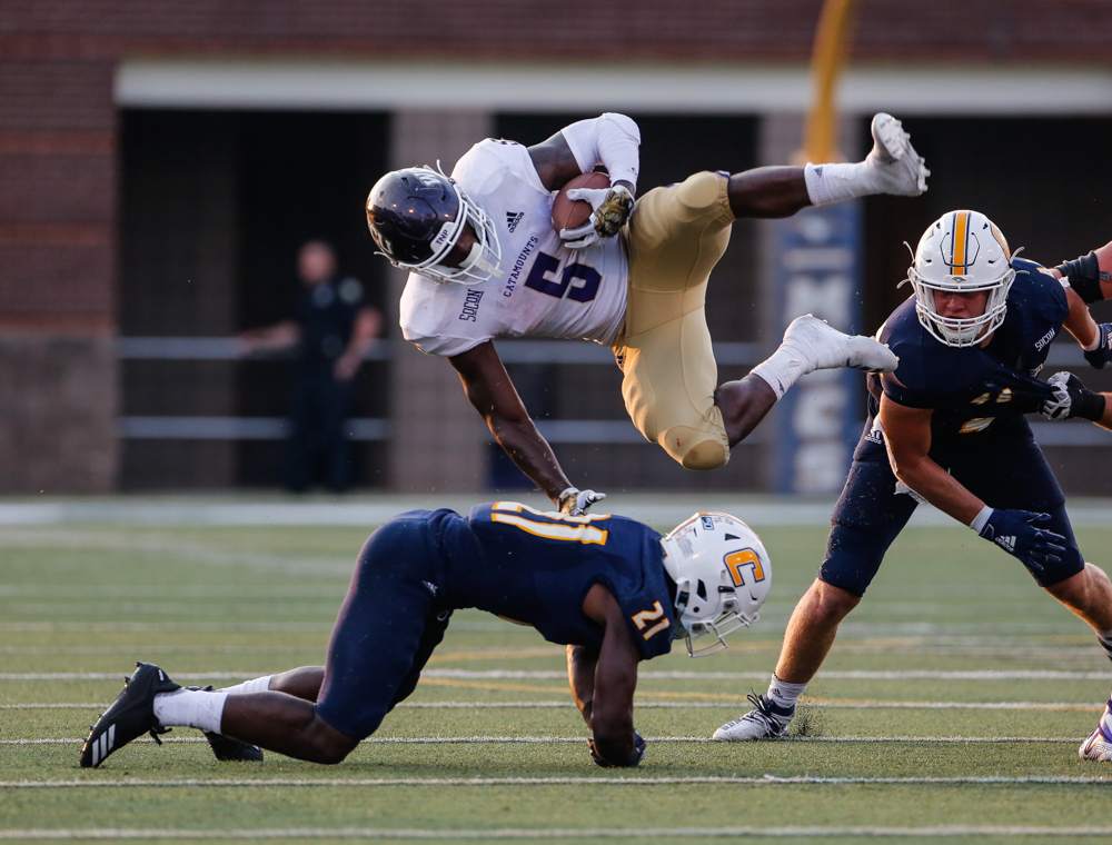 Elian Richter photo: Chattanooga Mocs defensive back D.J. Jackson stops a Western Carolina University player in a game at Finley Stadium.