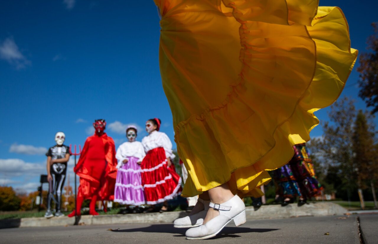 Troy Stolt photo: The dress of Ashley Ruiz, 14, of St. Peters, Missouri, flies in the air during the Our Lady of Guadalupe performance of "La Danza Del Torito" at the Missouri History Museum during the Dia de los Muertos celebration. Photo courtesy St. Louis Post-Dispatch.