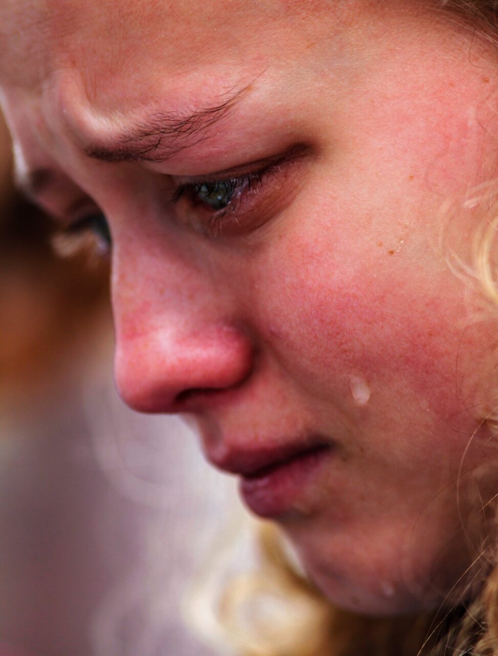 Troy Stolt photo: Tears roll down the face of Girls Preparatory School senior Ellie Swann during the Rally of Remembrance one year after the school shooting in Parkland, Florida.