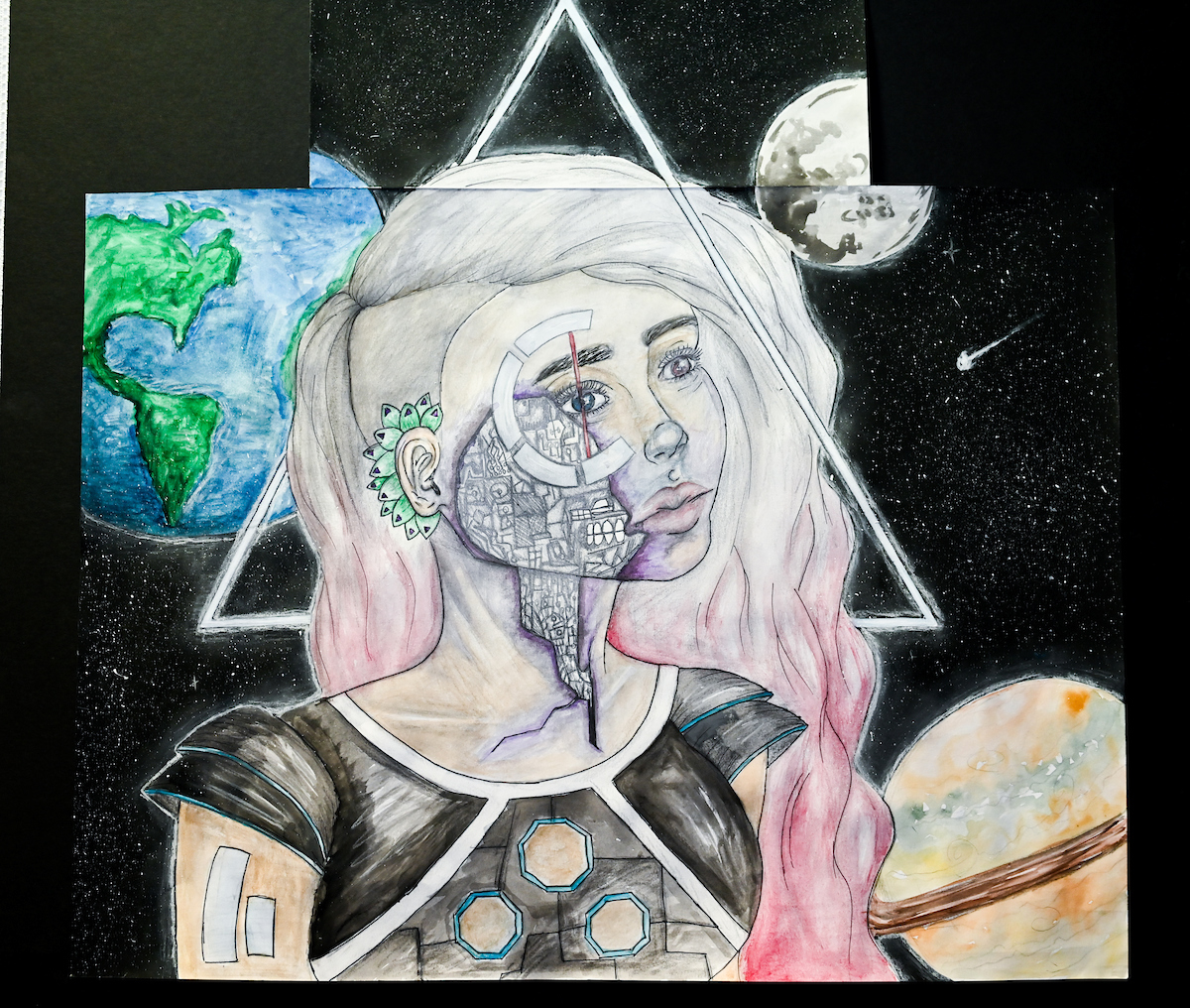 An illustration of a half robot woman with pink hair looking up. She is in futuristic clothing and behind her are countless stars, Earth to the left, the moon far back in the right, and Saturn in the bottom right in corner.