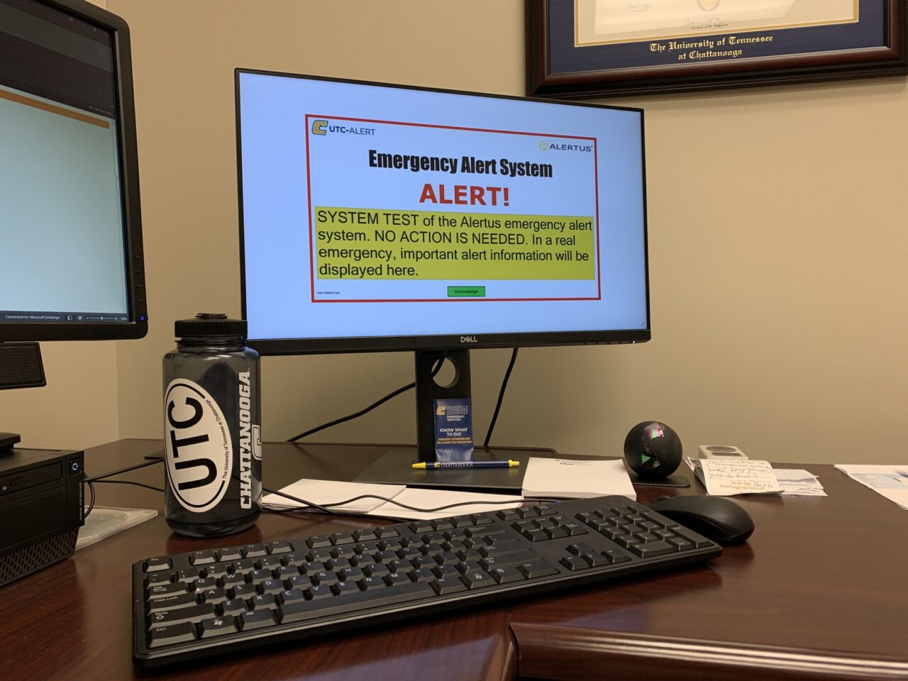 Laptop with "UTC-Alert" in the top left corner and large centered text "Emergency Alert System. Alert!" Centered below in medium text reads"SYSTEM TEST of the Alertus emergency alert system. NO ACTION IS NEEDED. IN a real emergency important alert information will be displayed here."