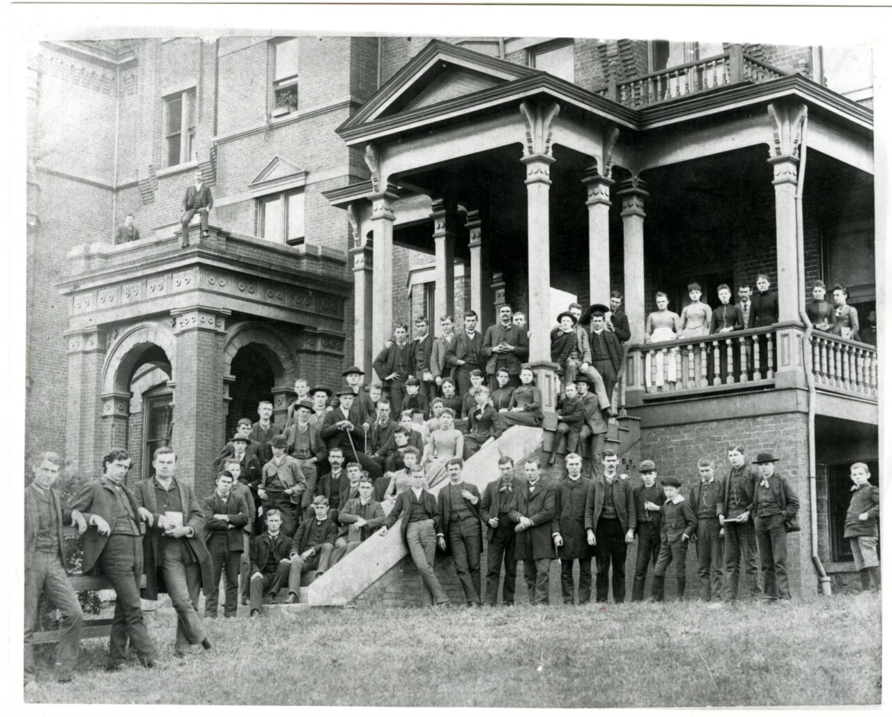 Students pose for photo in front of Old Main, 1888.
