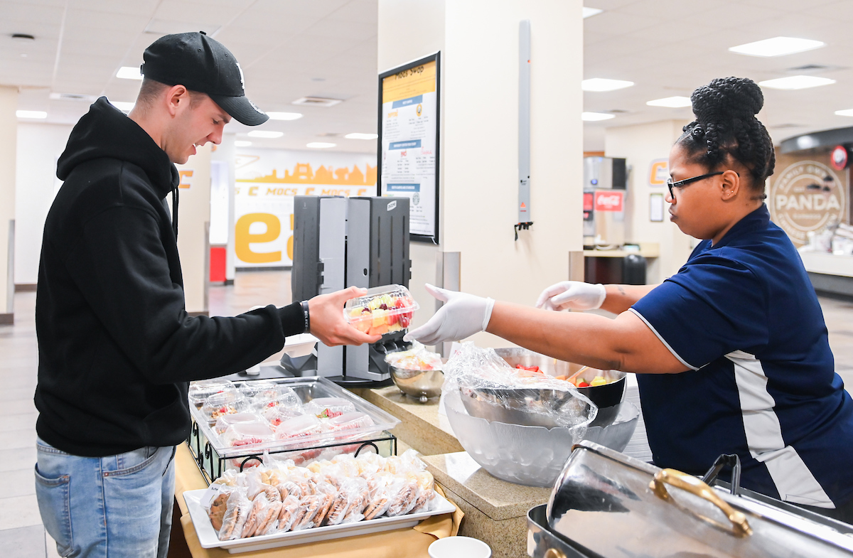 Aramark's Shelle Ware serves food from a shortened hot-food menu in the University Center.