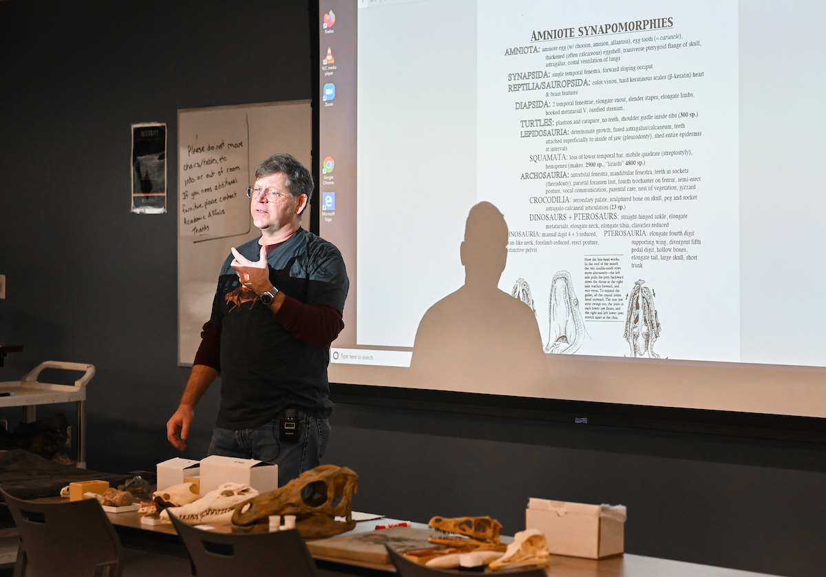 While being videotaped, Timothy Gaudin gives a zoology lecture to an empty classroom as he prepares for online teaching.